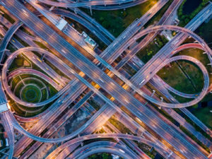 Top View Of Highway Road Junctions At Night. The Intersecting Fr